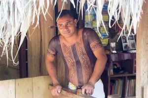 This is one of the teachers whom is provided by the government.  He dresses and lives like the Embera.